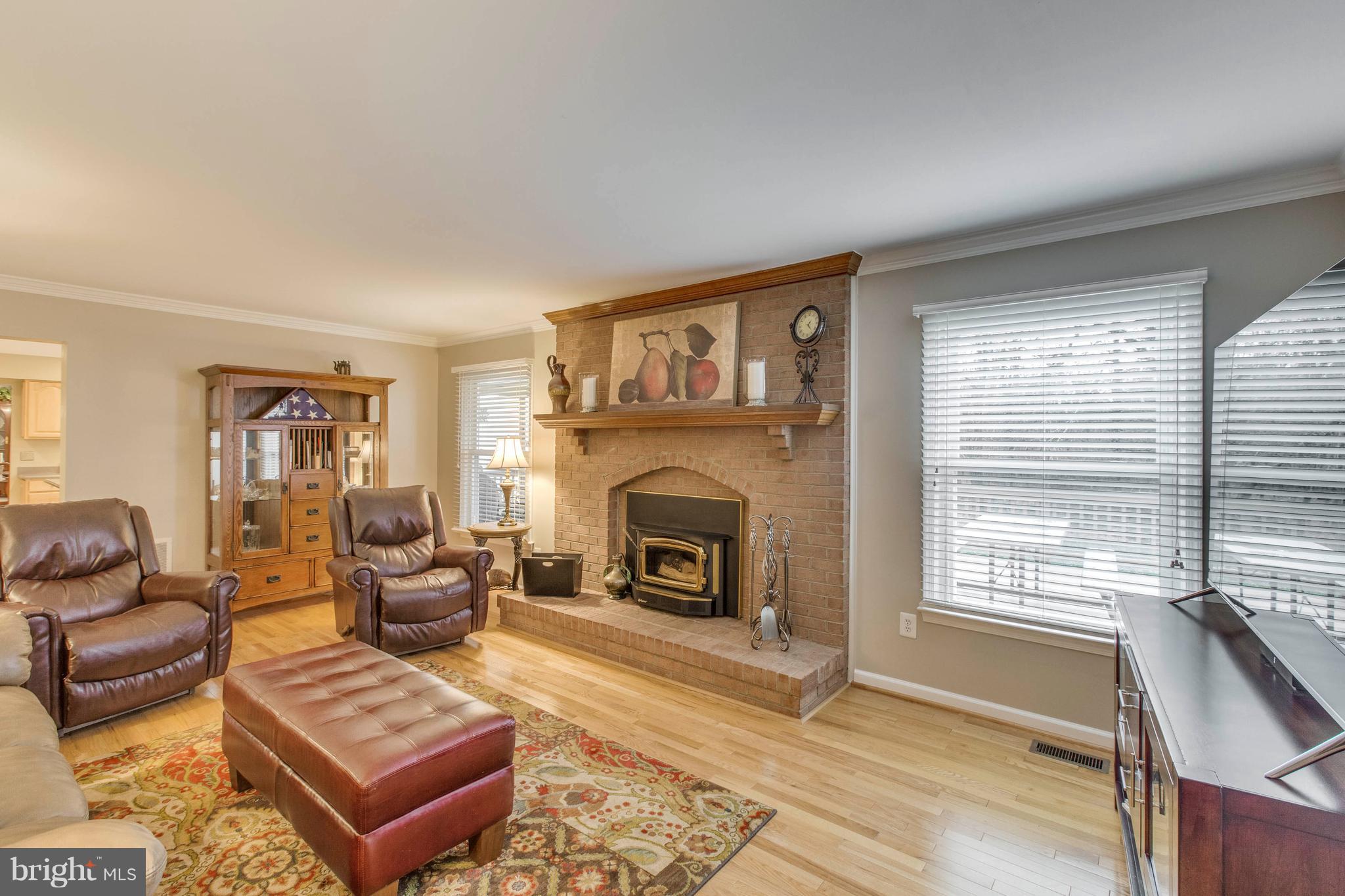 145 Peyton Road Sterling, VA 20165 - Photo 22 of 54 Family room with floor to ceiling brick fireplace