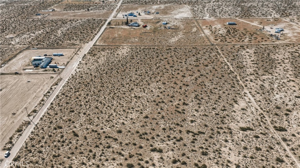 10384 Locust Road Lucerne Valley, CA 92356 - Photo 10 of 13 view of a dry yard with wooden floor