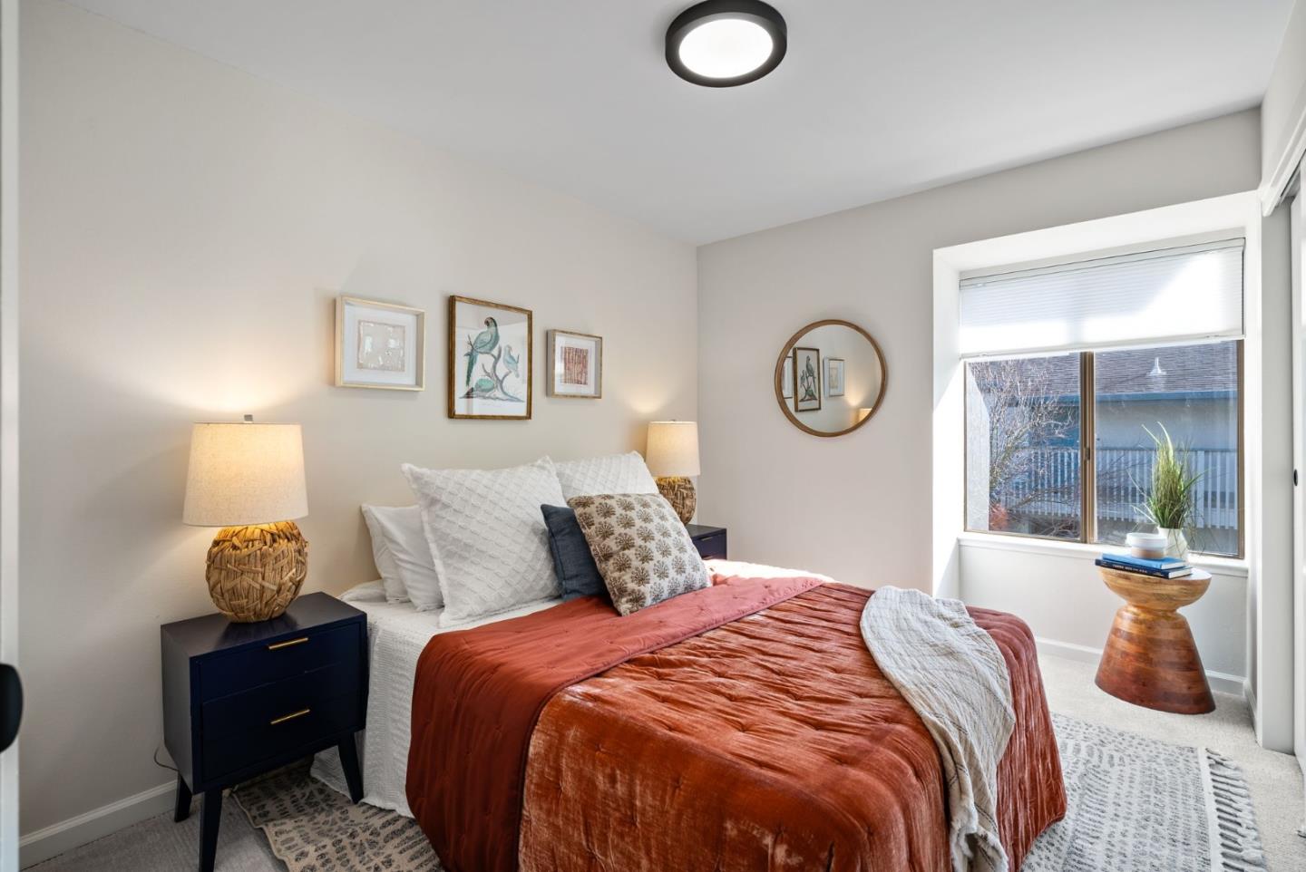 1925 46th Avenue, Unit 172 Capitola, CA 95010 - Photo 12 of 26 a bedroom with a bed and a lamp on table