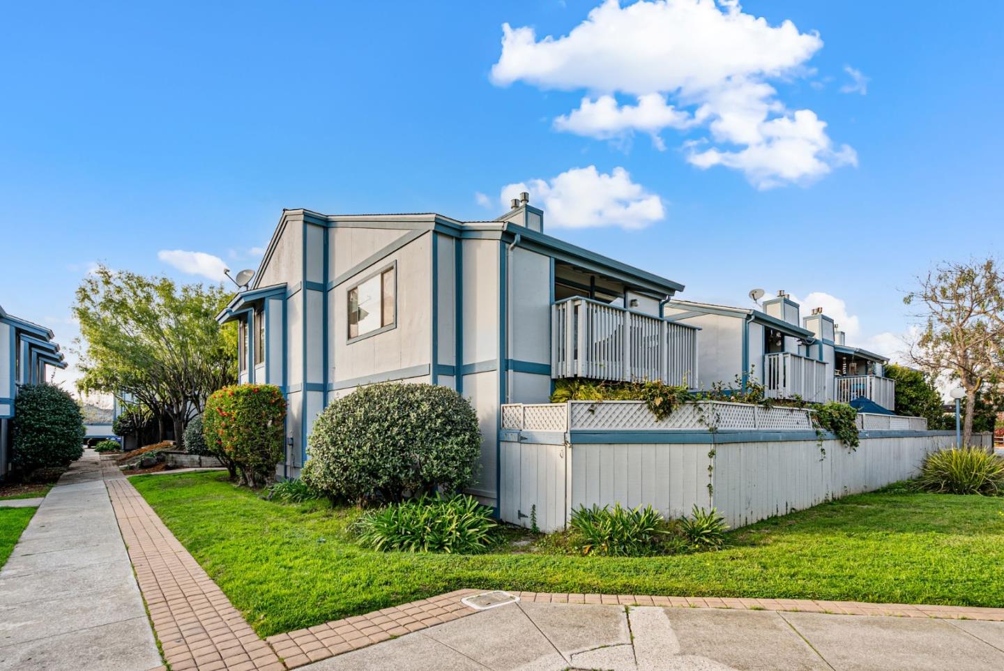 1925 46th Avenue, Unit 172 Capitola, CA 95010 - Photo 17 of 26 a front view of a house with a yard