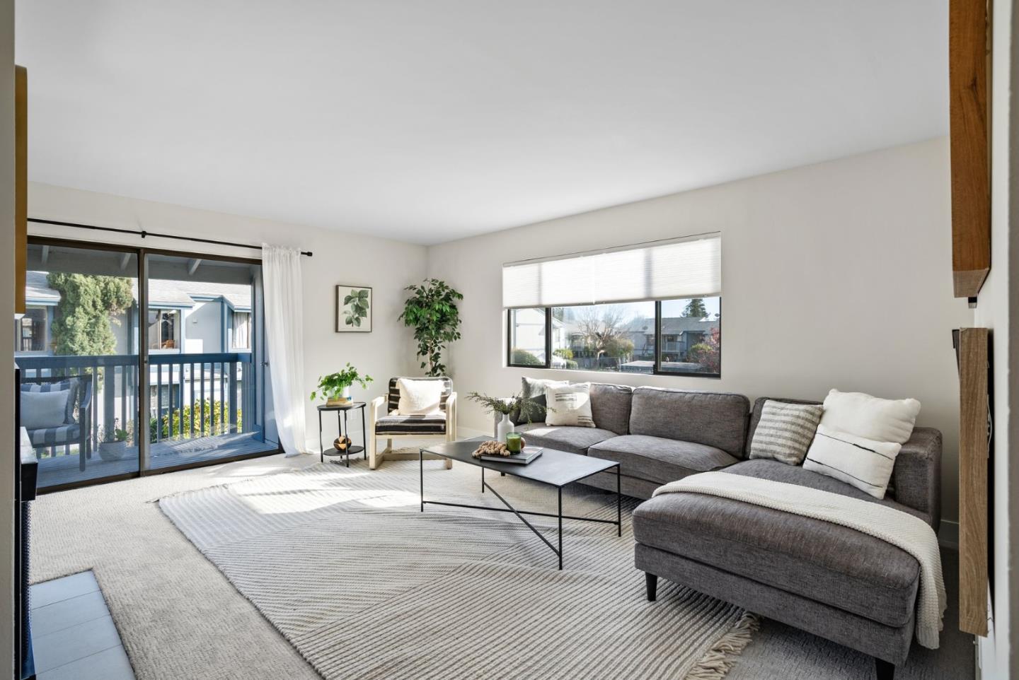 1925 46th Avenue, Unit 172 Capitola, CA 95010 - Photo 2 of 26 a living room with furniture and a floor to ceiling window