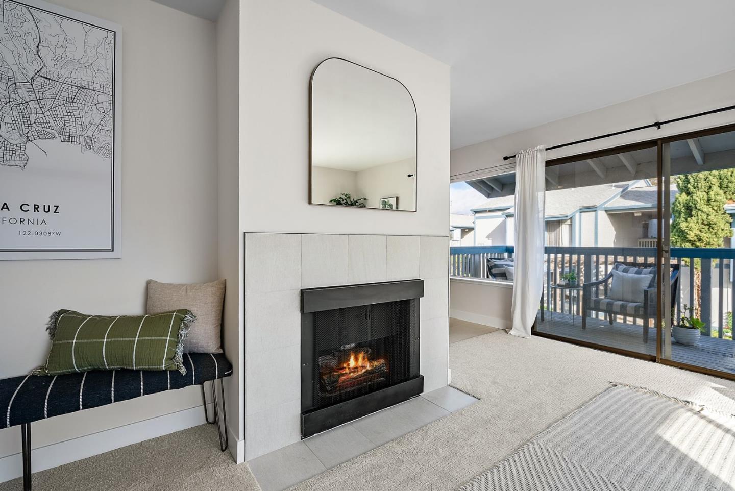 1925 46th Avenue, Unit 172 Capitola, CA 95010 - Photo 3 of 26 a living room with furniture a fireplace and a floor to ceiling window