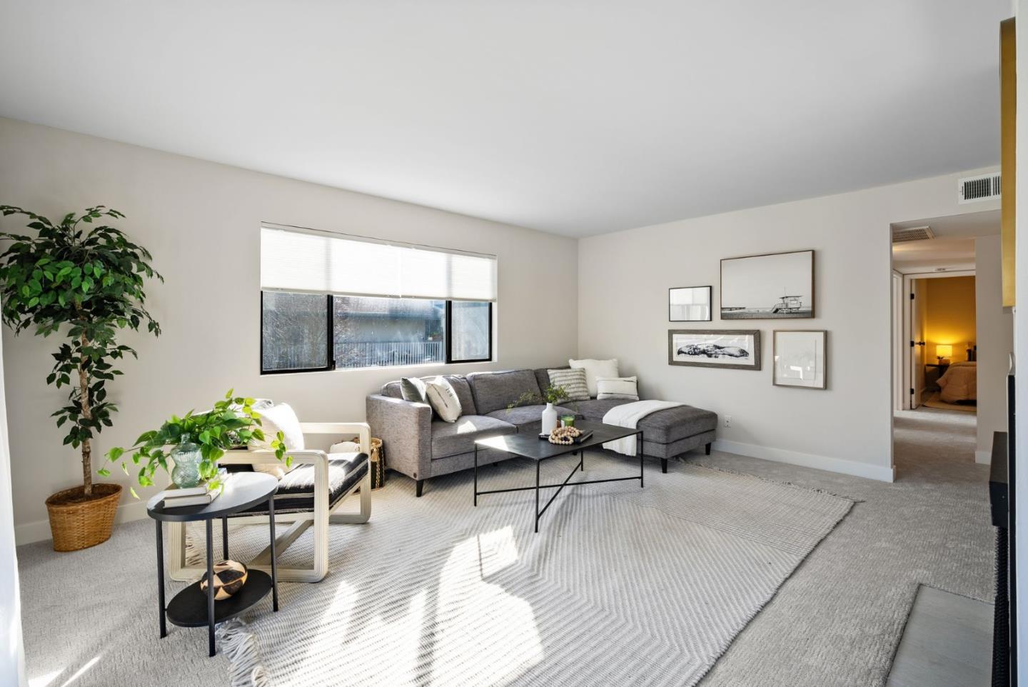 1925 46th Avenue, Unit 172 Capitola, CA 95010 - Photo 4 of 26 a living room with furniture and a potted plant