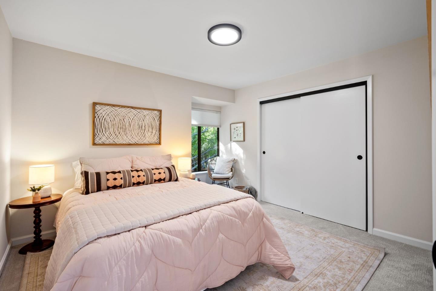 1925 46th Avenue, Unit 172 Capitola, CA 95010 - Photo 9 of 26 a bedroom with a large bed and a chandelier