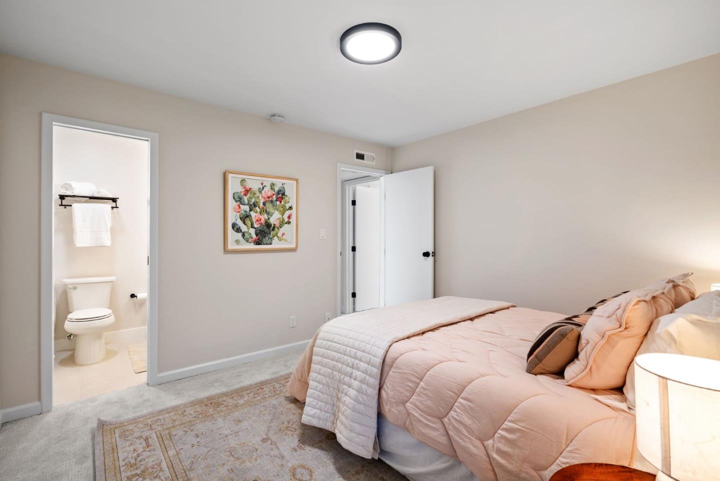 1925 46th Avenue, Unit 172 Capitola, CA 95010 - Photo 10 of 26 a bedroom with a bed and bathroom
