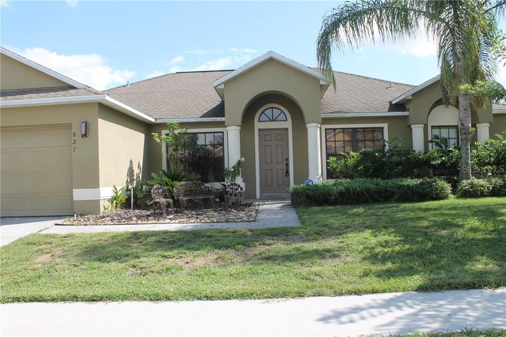 827 Coventry Road Davenport, FL 33897 - Photo 1 of 1 a view of a house with backyard and sitting area