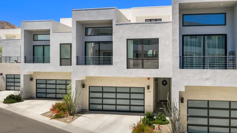 a front view of a house with a garage