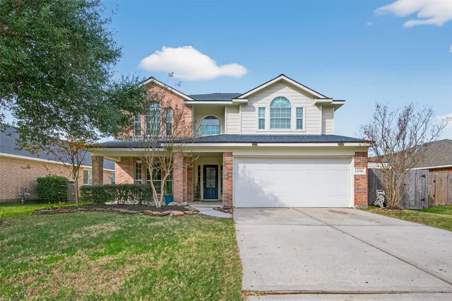 a view of house with yard and entertaining space