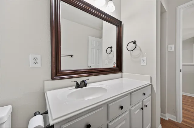 a bedroom with furniture and a flat screen tv