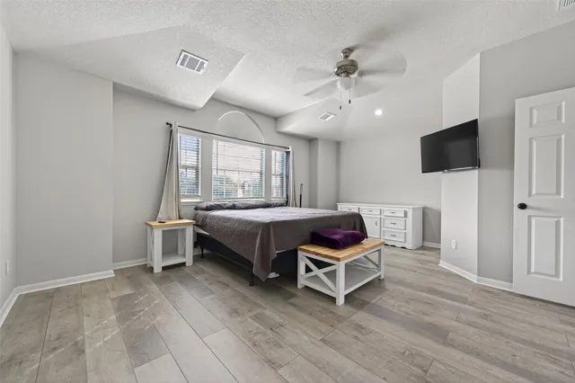 a white bath tub sitting next to a white sink