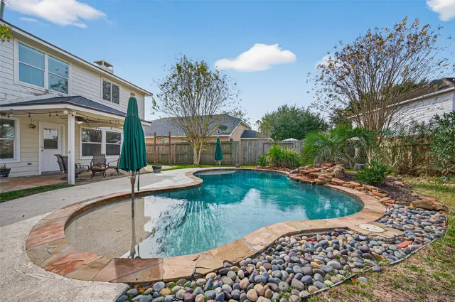 an aerial view of a house with outdoor space