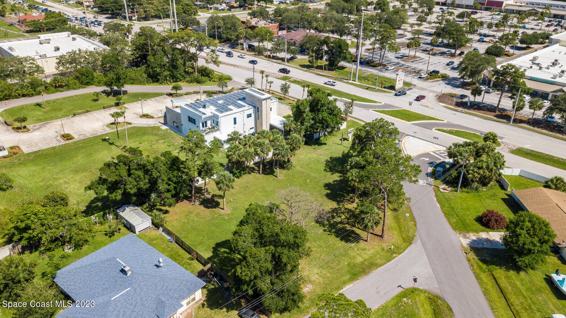 0 Unknown Drive Melbourne, FL 32935 - Photo 5 of 8 an aerial view of residential houses with outdoor space and street view