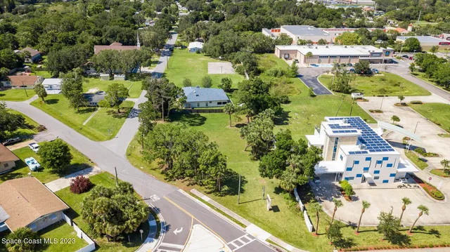 an aerial view of residential house with outdoor space