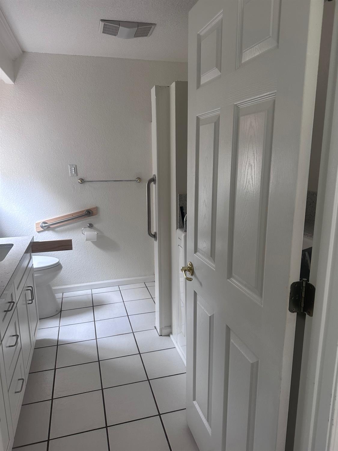 7124 Ospital Road Valley Springs, CA 95252 - Photo 20 of 37 a bathroom with a sink a toilet and shower