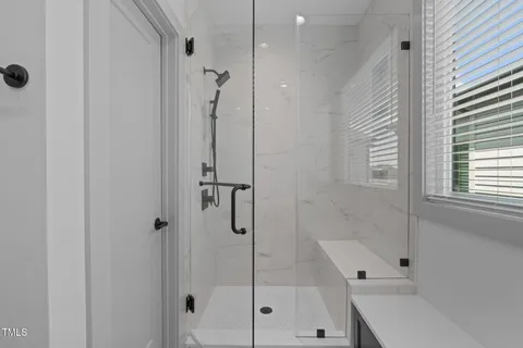 a bathroom with a shower and a bathtub