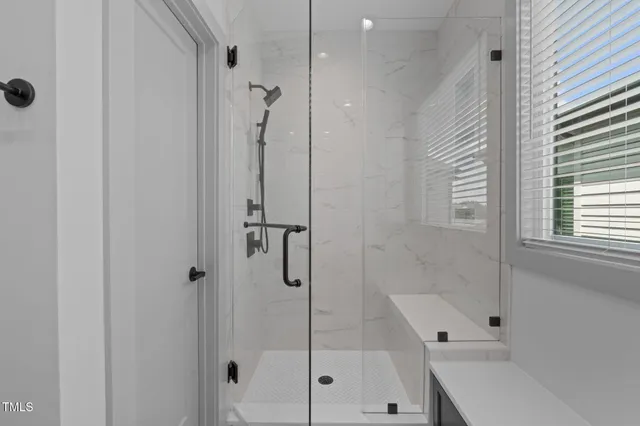 a bathroom with a shower and a bathtub
