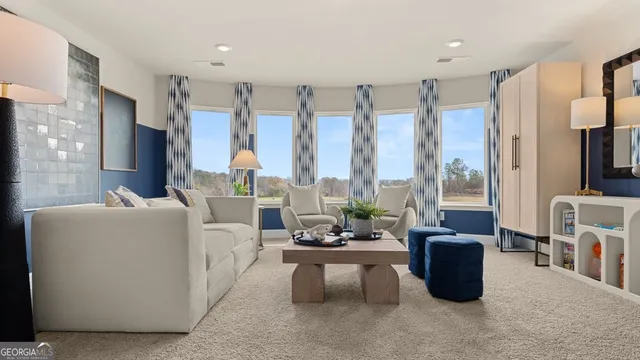 a living room with furniture a large window and a flat screen tv