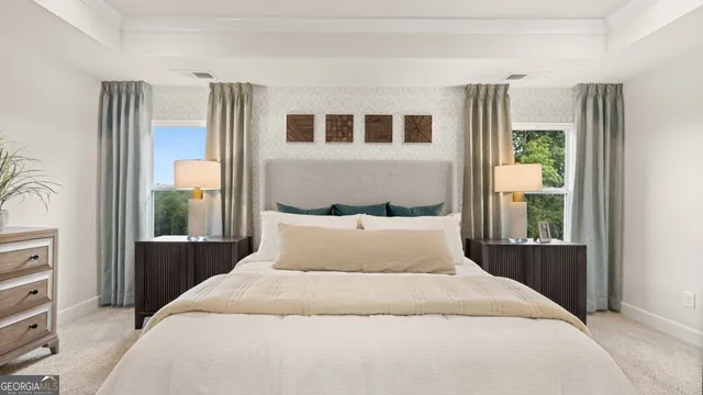 a bedroom with a large bed and a window