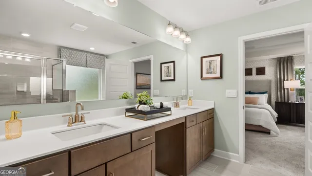 a bathroom with double sink and a mirror