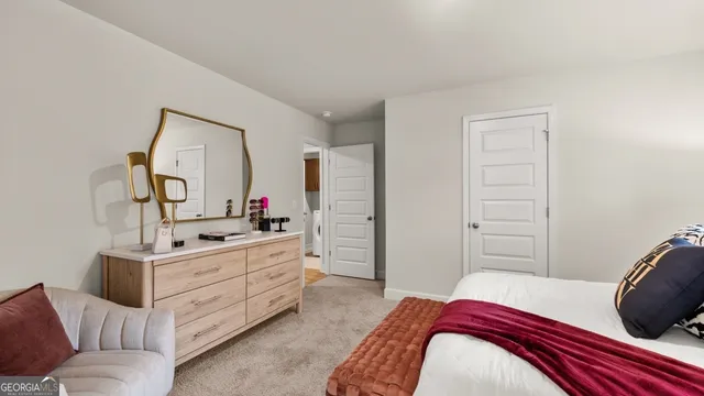 a bedroom with a bed and a dresser