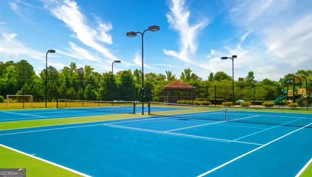 a view of an outdoor space and tennis court