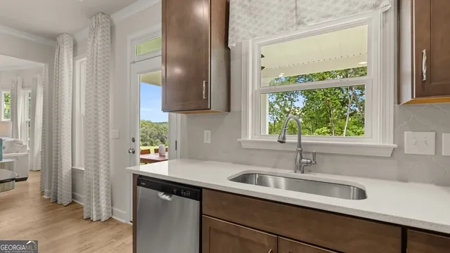 a kitchen with a sink and a window