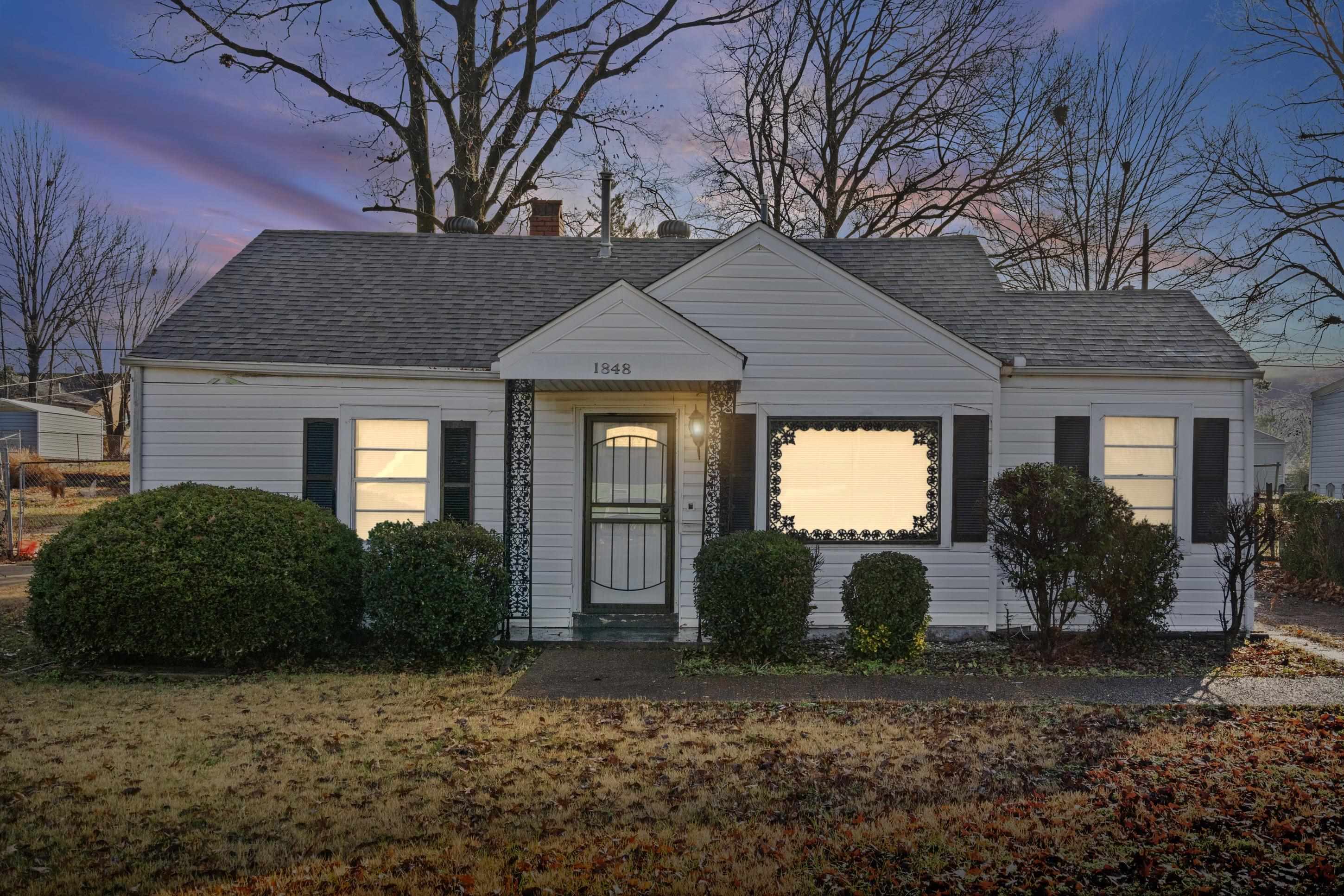 1848 Wynton Street Memphis, TN 38106 - Photo 4 of 22 View of front facade featuring a chimney and a shingled roof
