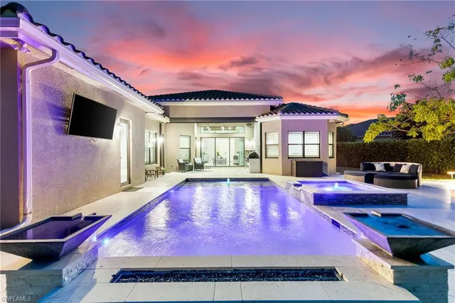 a swimming pool with outdoor seating