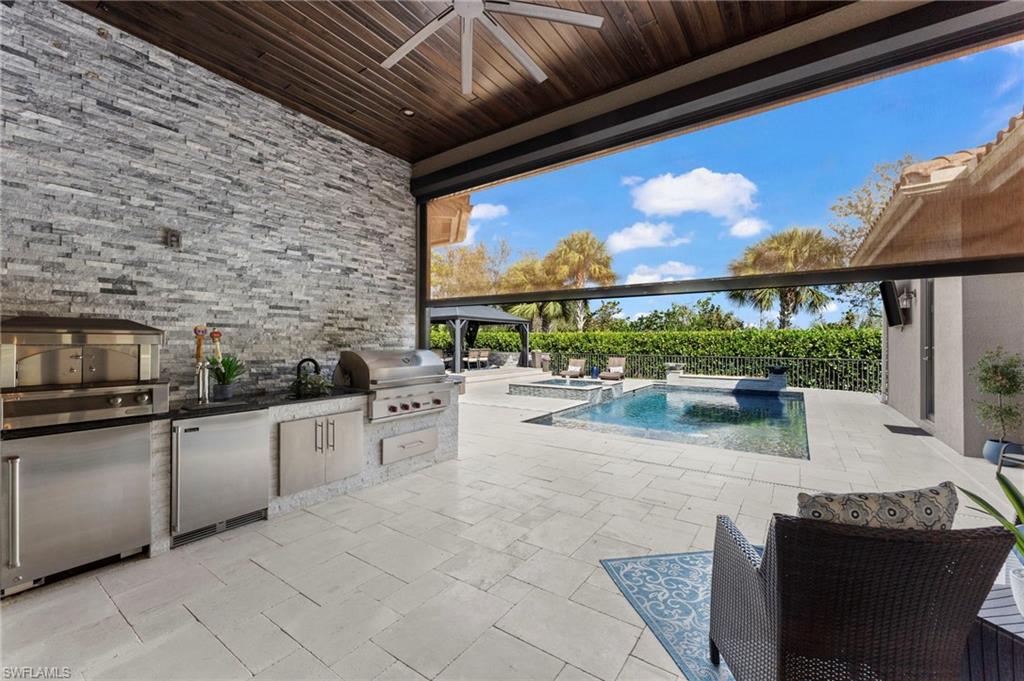 4605 Azalea Drive Naples, FL 34119 - Photo 12 of 50 a large white kitchen with a large window