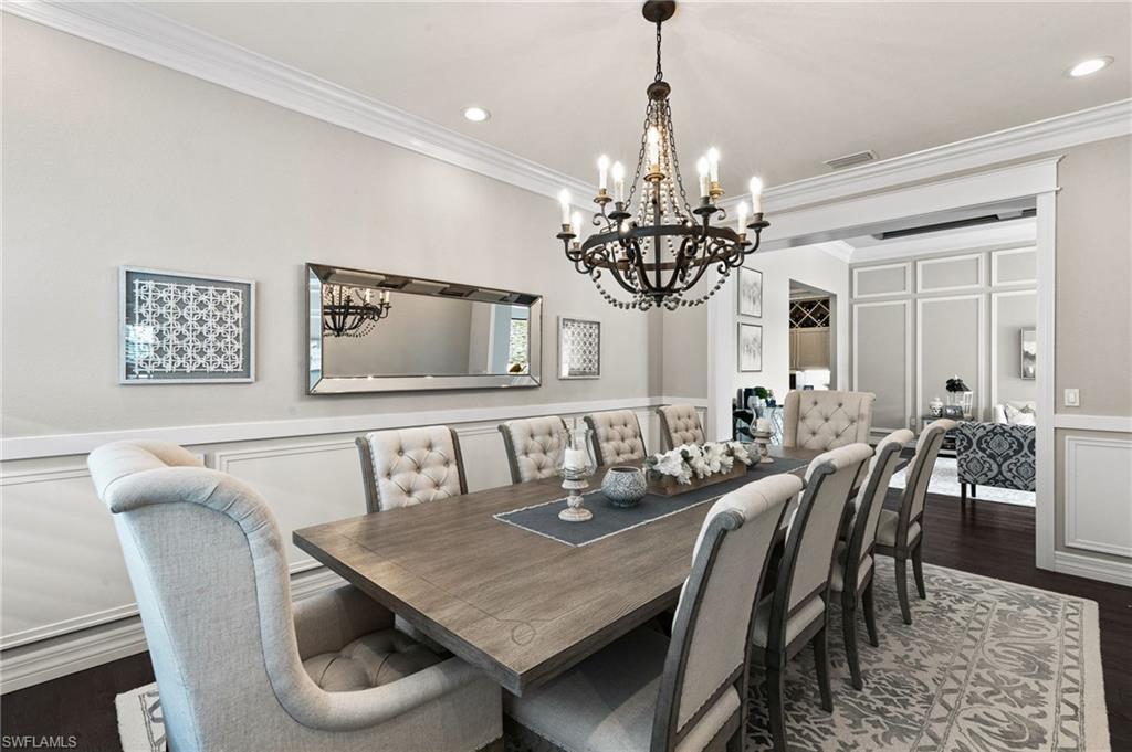 4605 Azalea Drive Naples, FL 34119 - Photo 16 of 50 a view of a dining room with furniture a chandelier and window