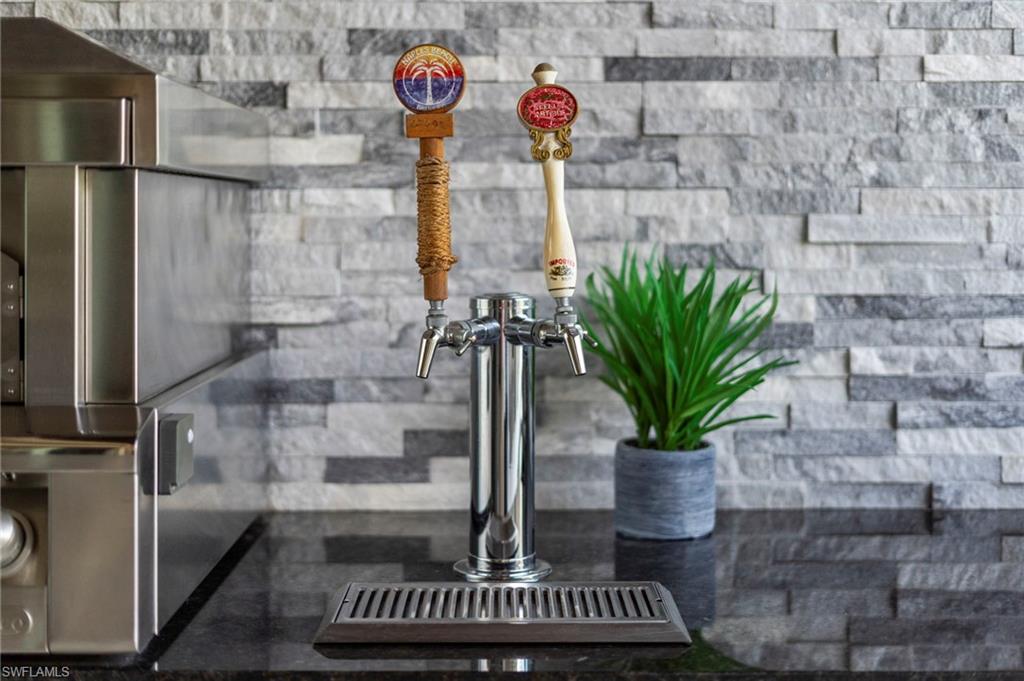 4605 Azalea Drive Naples, FL 34119 - Photo 43 of 50 a glass vase with flowers on a table