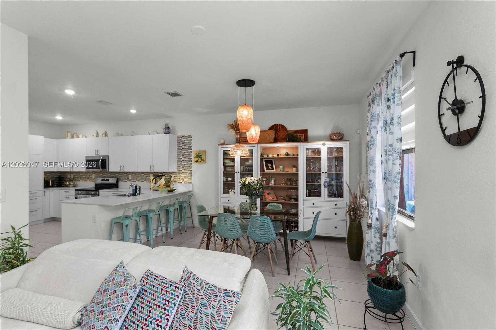 12862 Southwest 231st Street Miami, FL 33170 - Photo 11 of 30 a living room with furniture a window and kitchen view