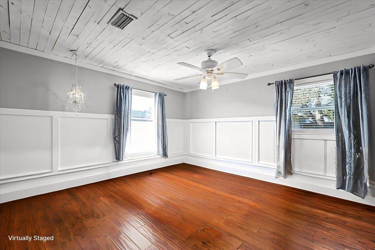 979 Altara Avenue St. Augustine, FL 32086 - Photo 12 of 27 an empty room with wooden floor fan and windows