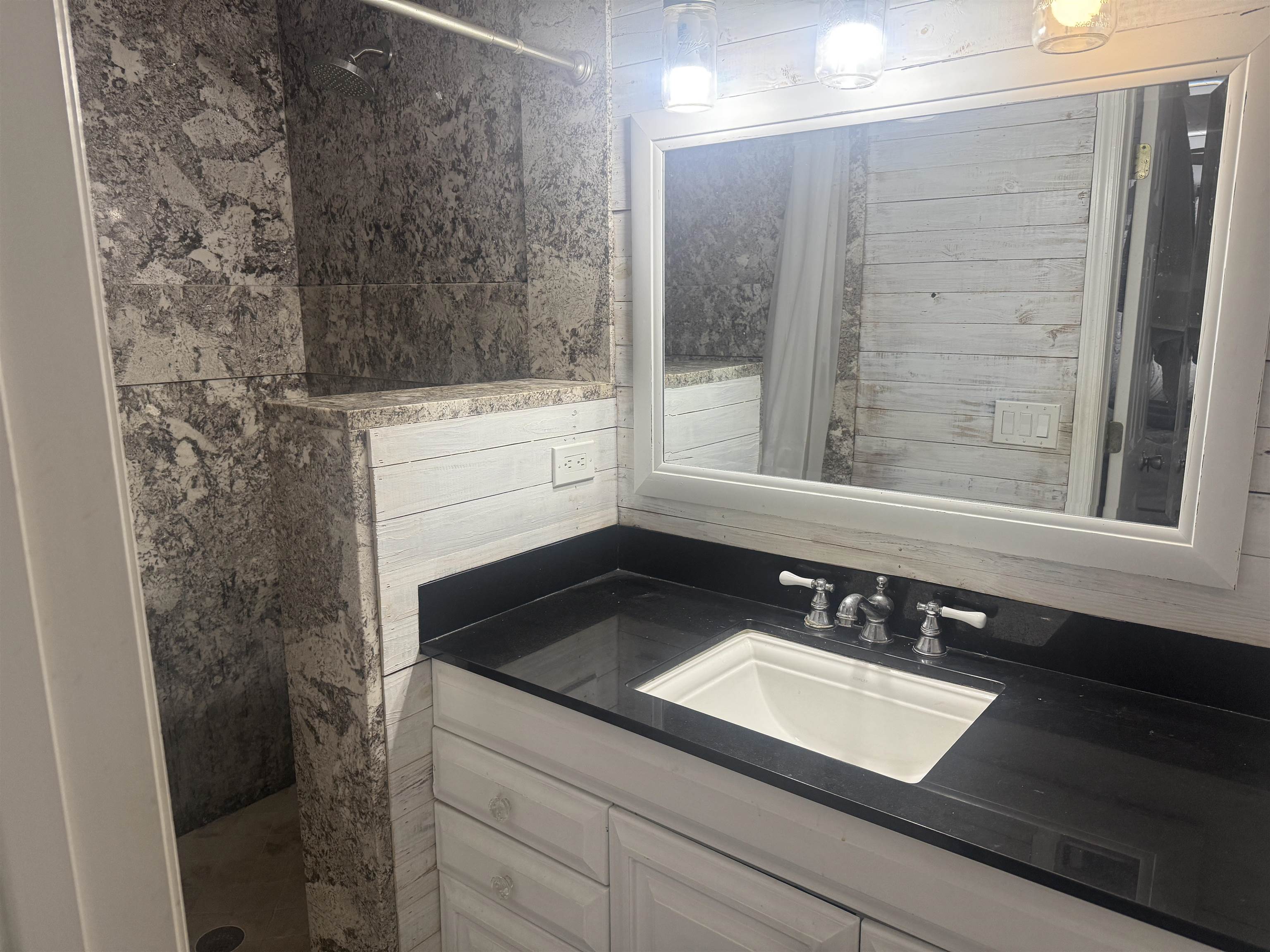 979 Altara Avenue St. Augustine, FL 32086 - Photo 14 of 27 a bathroom with a sink and a mirror