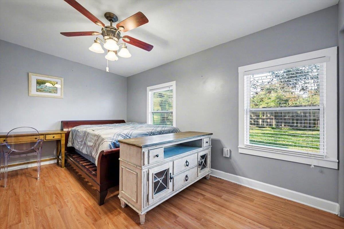 979 Altara Avenue St. Augustine, FL 32086 - Photo 15 of 27 a bedroom with a bed and a chandelier