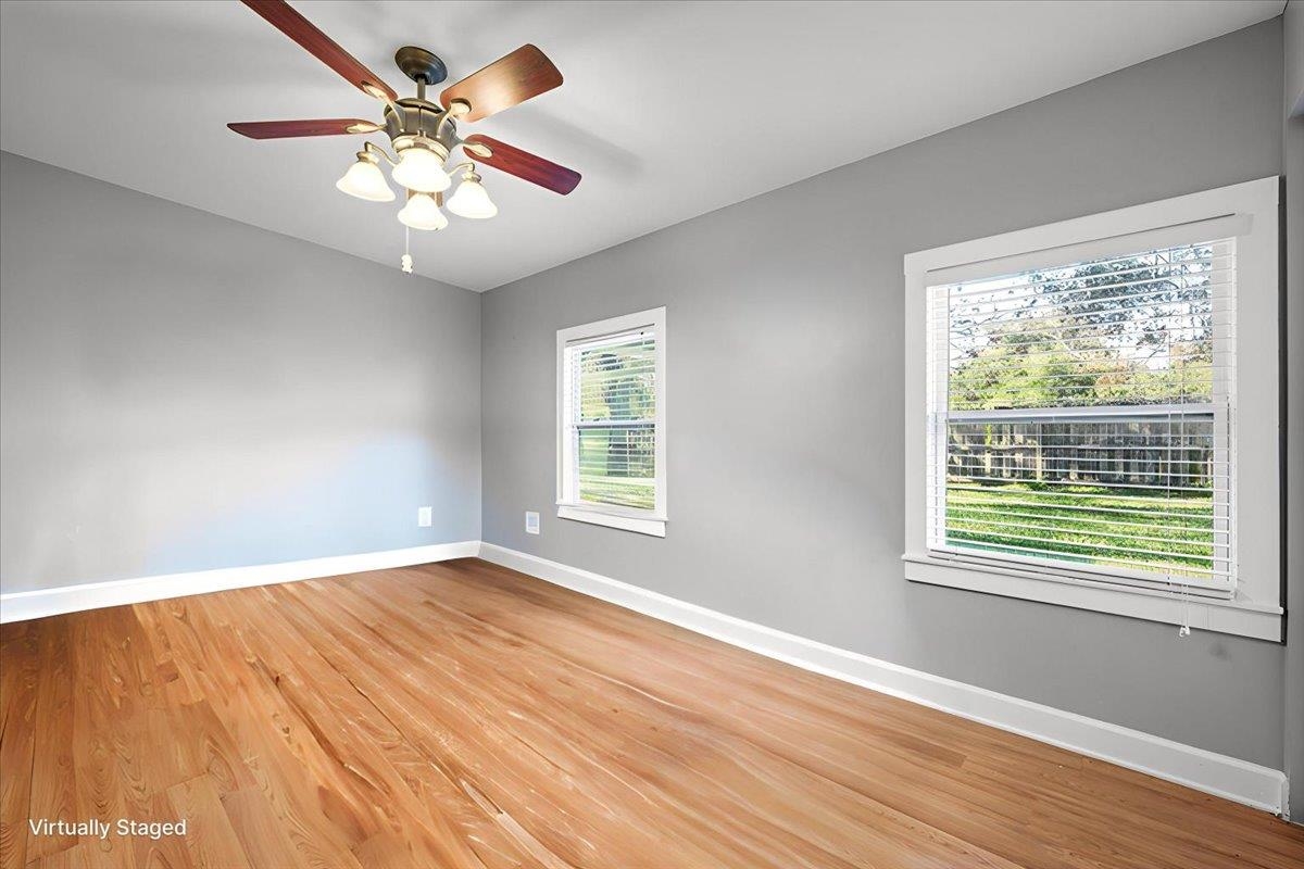 979 Altara Avenue St. Augustine, FL 32086 - Photo 16 of 27 a view of an empty room with wooden floor and a window