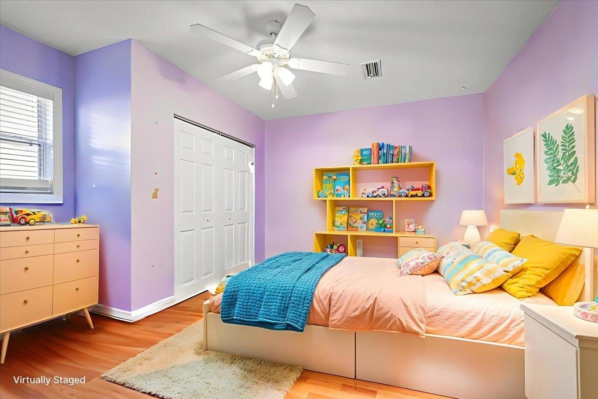 979 Altara Avenue St. Augustine, FL 32086 - Photo 20 of 27 a bedroom with a bed and a chandelier