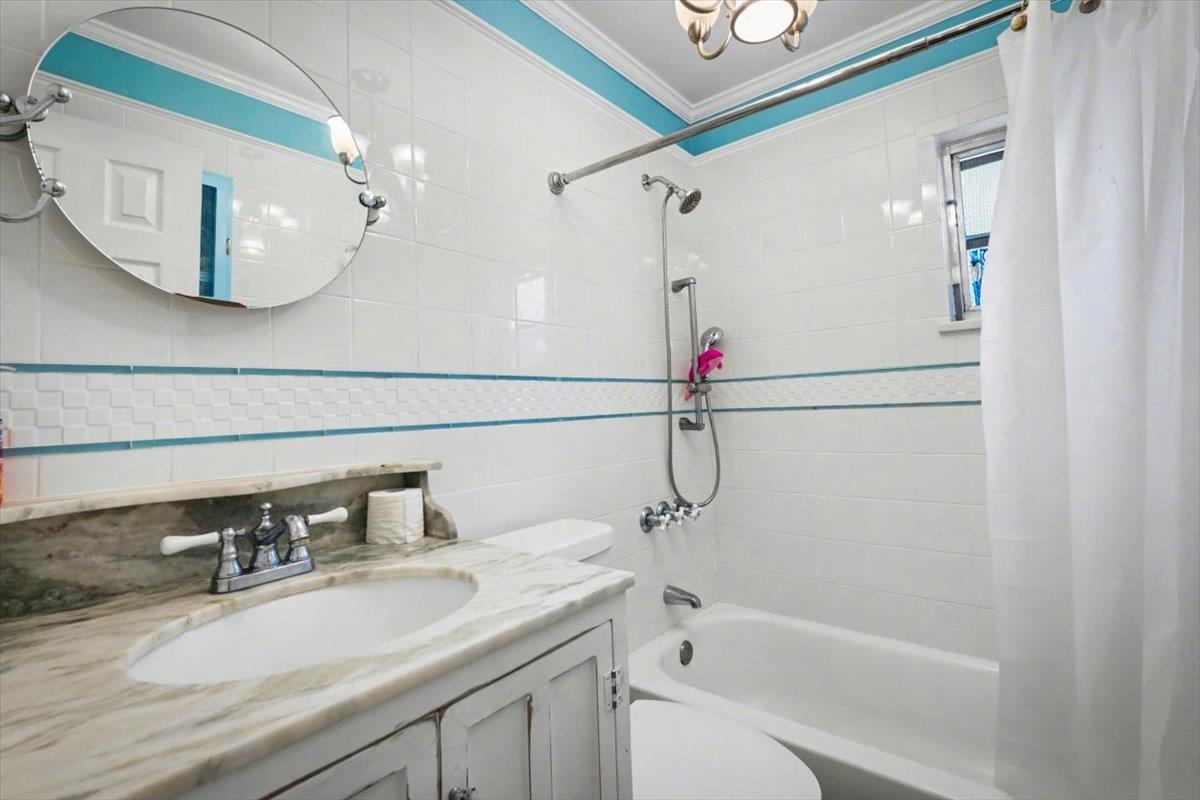 979 Altara Avenue St. Augustine, FL 32086 - Photo 21 of 27 a bathroom with a sink and a mirror