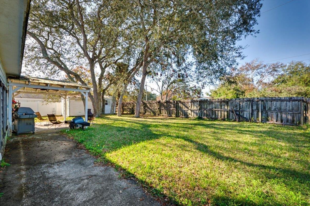 979 Altara Avenue St. Augustine, FL 32086 - Photo 24 of 27 a view of a yard with large trees