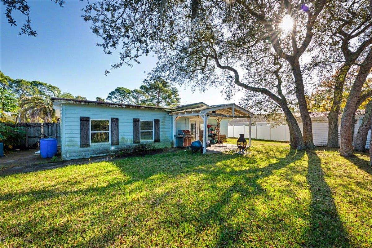 979 Altara Avenue St. Augustine, FL 32086 - Photo 26 of 27 a view of a house with swimming pool and sitting area