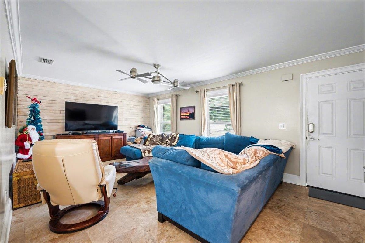 979 Altara Avenue St. Augustine, FL 32086 - Photo 3 of 27 a living room with furniture and a flat screen tv