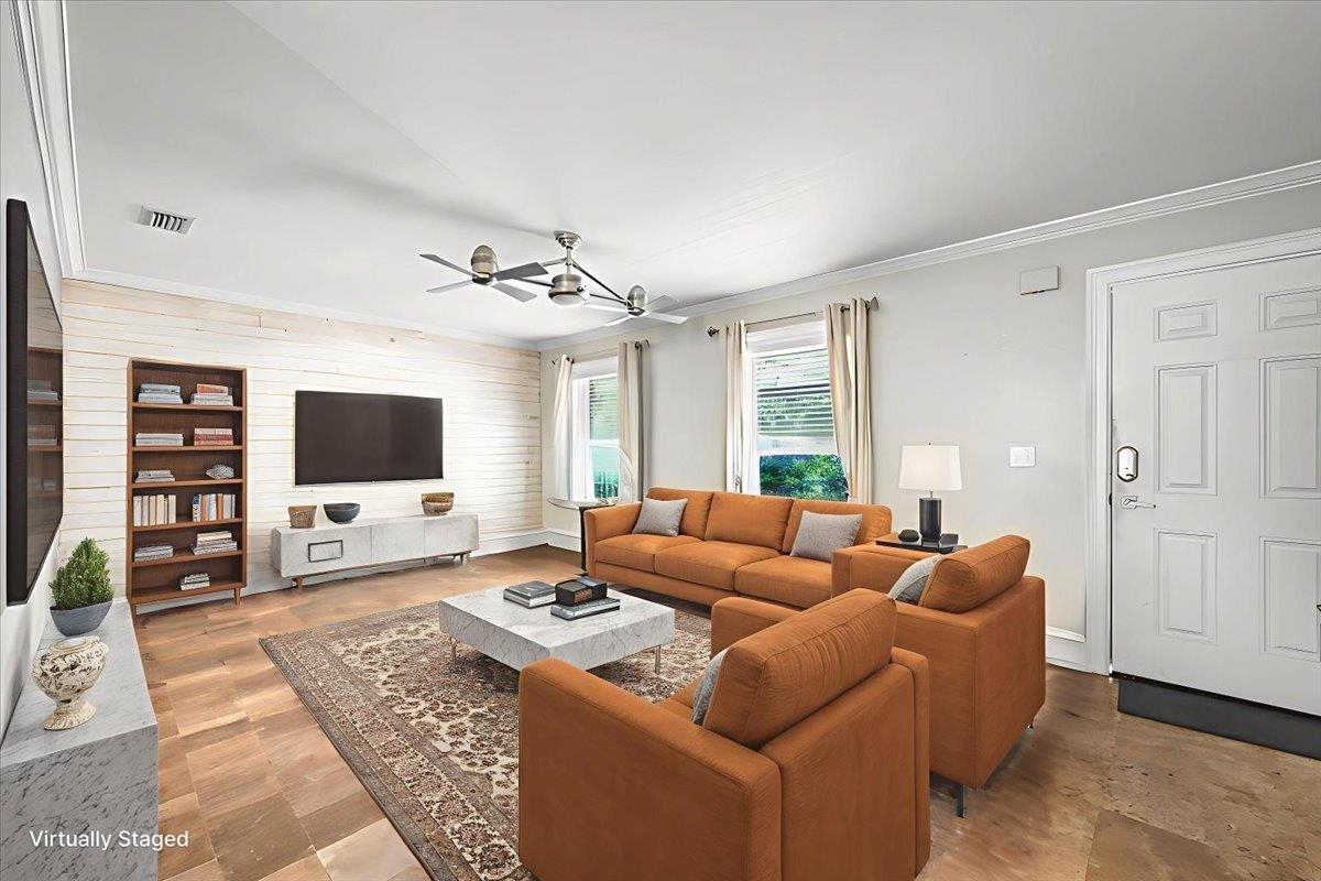 979 Altara Avenue St. Augustine, FL 32086 - Photo 5 of 27 a living room with furniture a flat screen tv and a large window