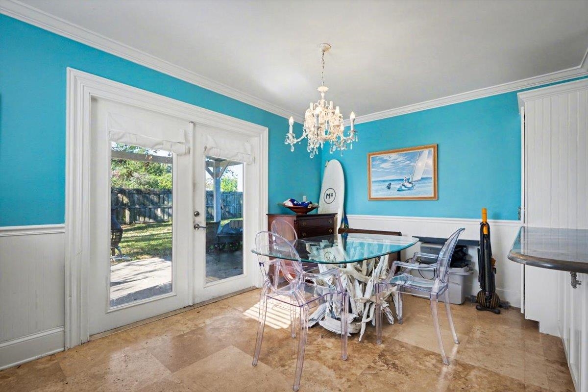 979 Altara Avenue St. Augustine, FL 32086 - Photo 8 of 27 a view of a dining room with furniture and a chandelier