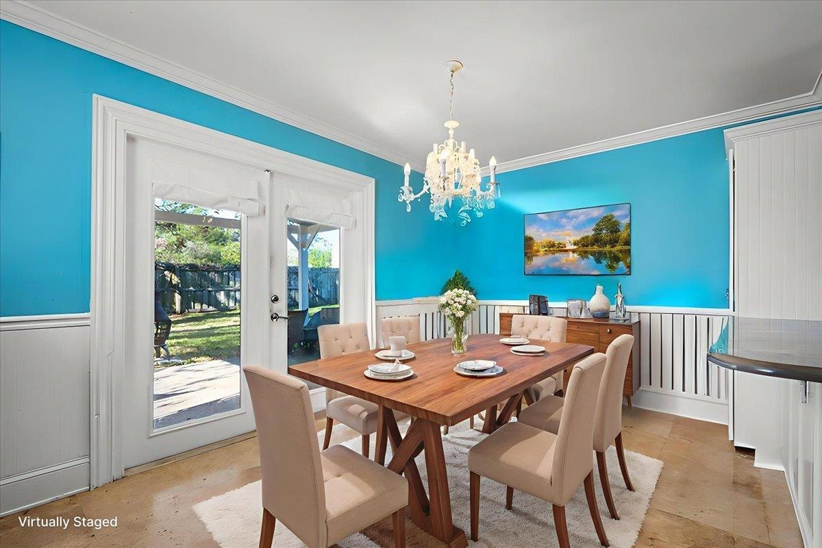 979 Altara Avenue St. Augustine, FL 32086 - Photo 10 of 27 a view of a dining room with furniture a chandelier and wooden floor