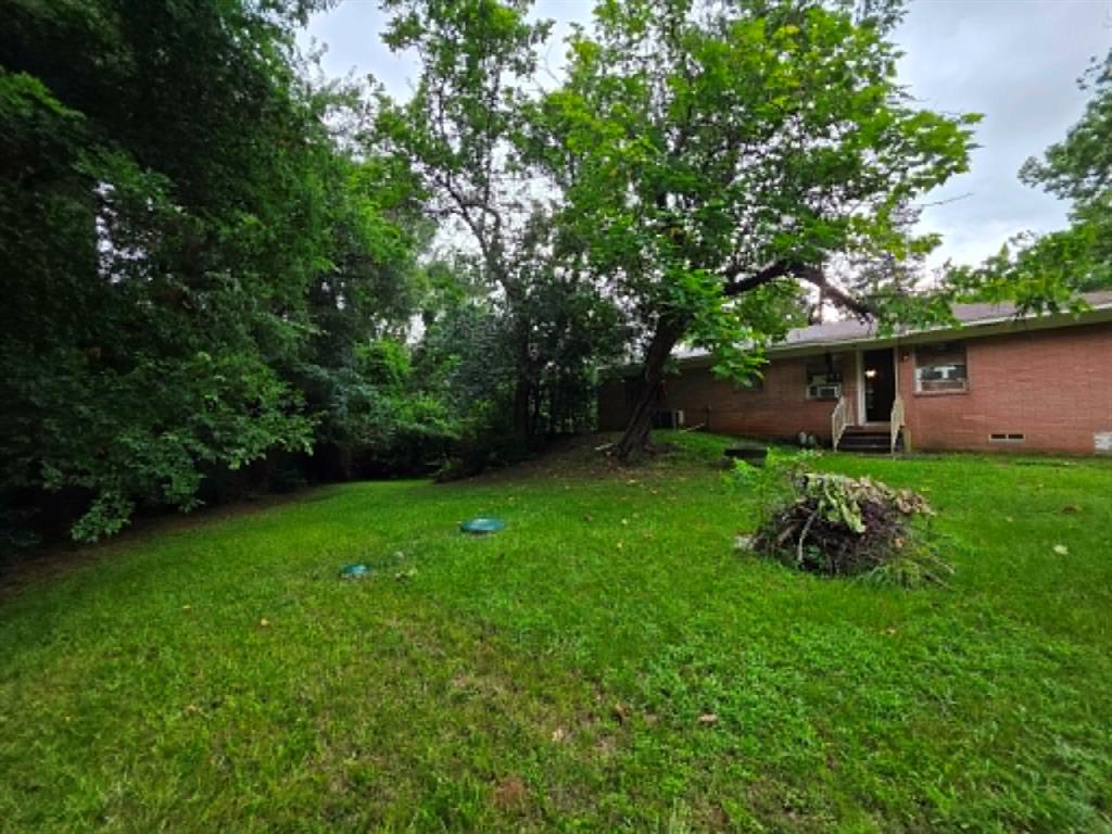 4514 West Loop 281 Longview, TX 75604 - Photo 7 of 36 Expansive green lawn providing ample outdoor space