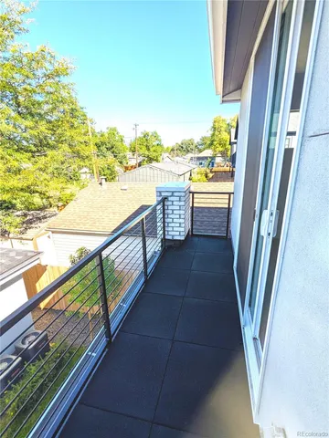 a view of balcony with hardwood floor