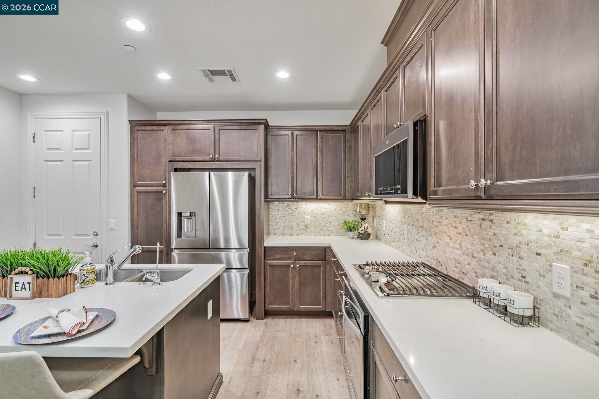 6260 Main Branch Road San Ramon, CA 94582 - Photo 11 of 38 a kitchen that has a sink and a stove in it