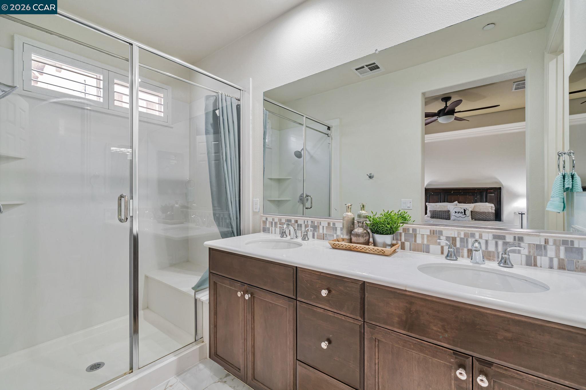 6260 Main Branch Road San Ramon, CA 94582 - Photo 22 of 38 a spacious bathroom with a granite countertop sink mirror and double