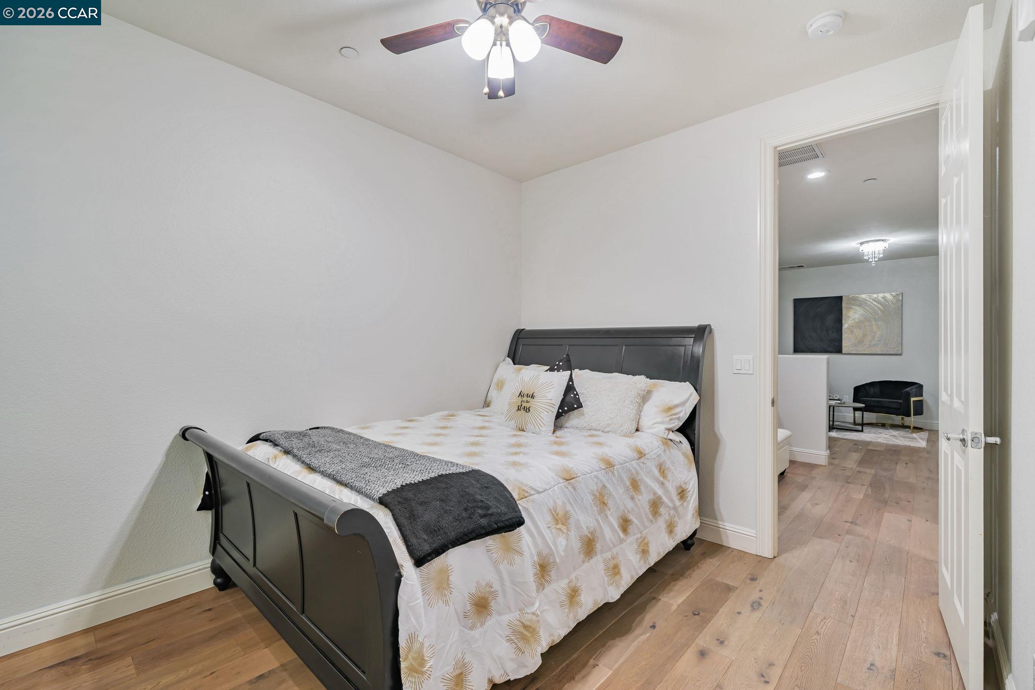 6260 Main Branch Road San Ramon, CA 94582 - Photo 23 of 38 a bedroom with a bed and a chandelier