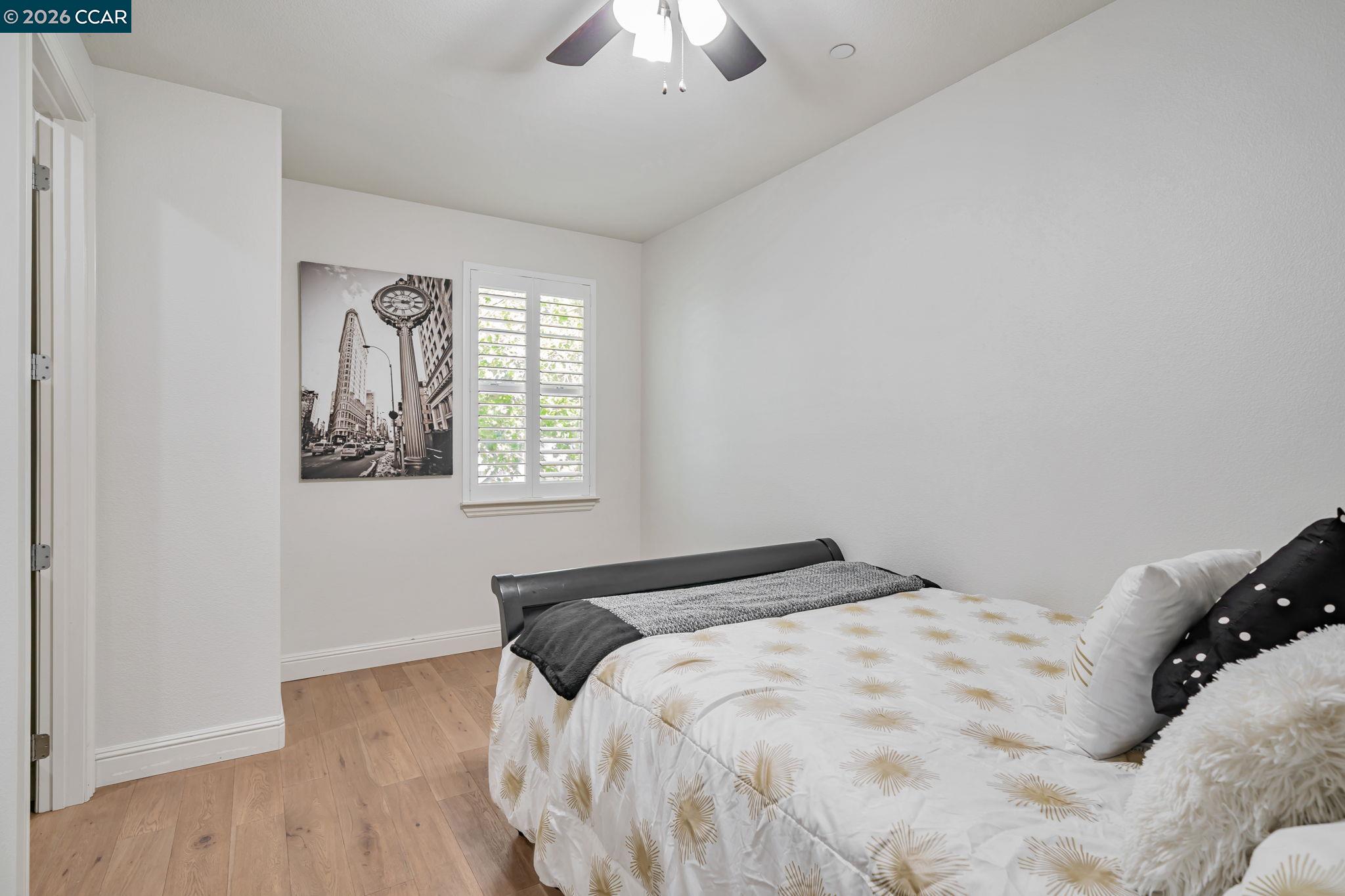 6260 Main Branch Road San Ramon, CA 94582 - Photo 24 of 38 a bedroom with a bed and a chandelier